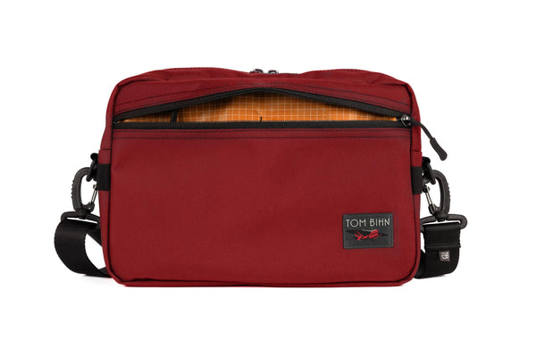 The Side Hustle in Mars Red Ballistic with Zest 200 Halcyon interior.